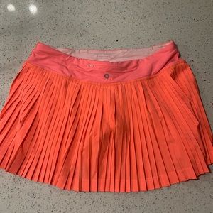 pleat to street lululemon bright coral/orange skirt